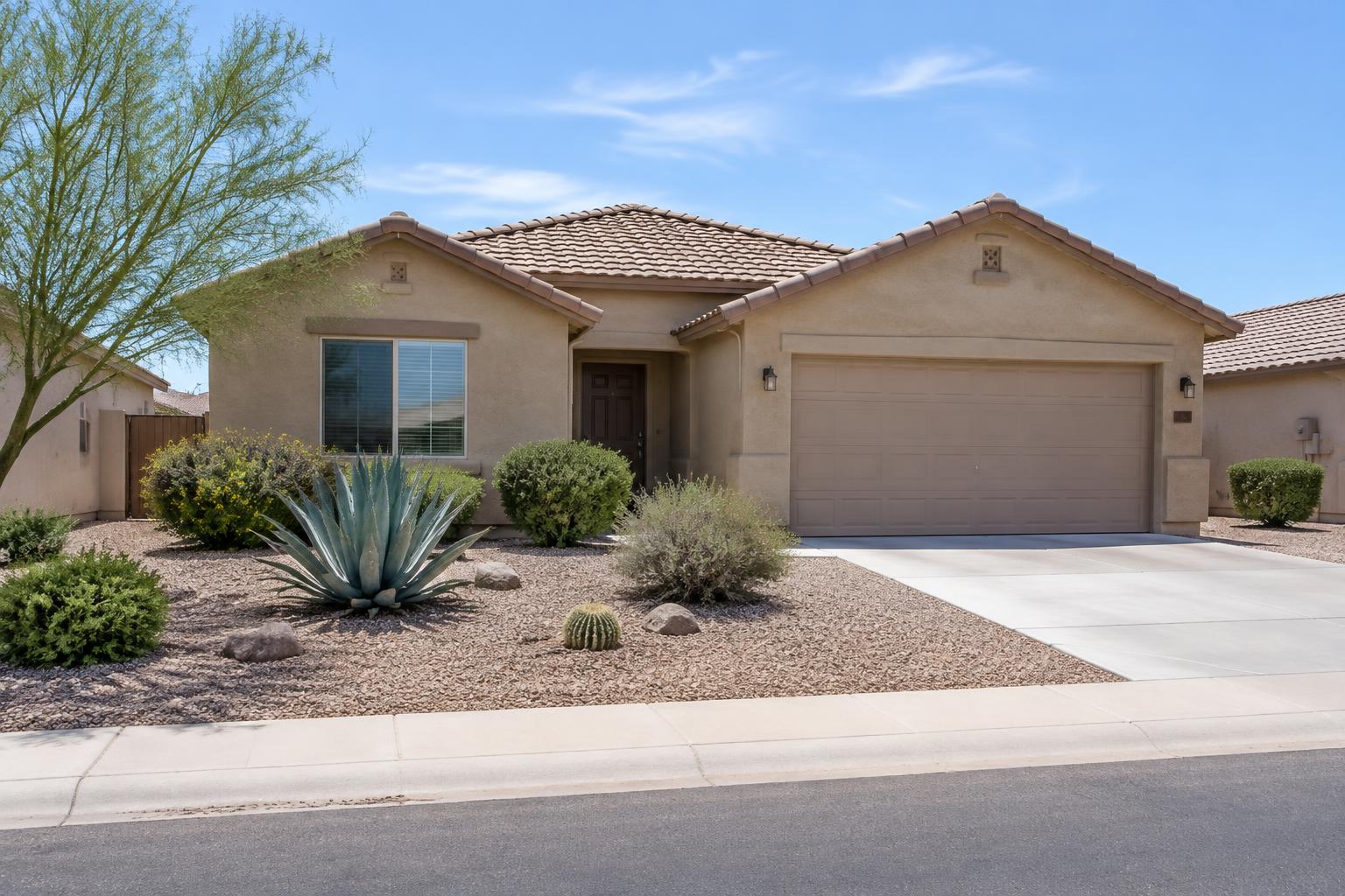 Arizona stucco home with tile roof and desert landscaping